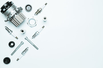 Car service. Auto motor mechanic spare or automotive piece on white background. Set of new metal car part. Repair and vehicle service with space for text.