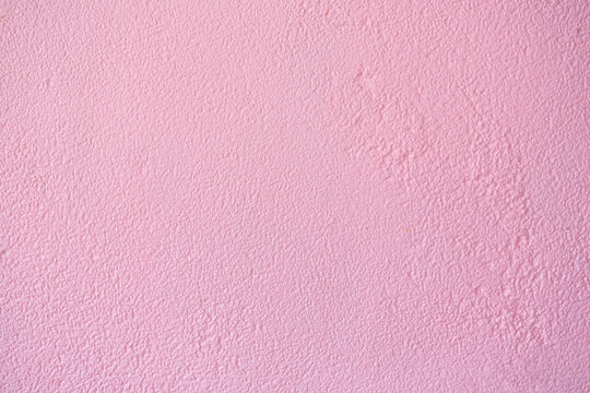 Pink cement or concrete wall texture for background. High resolution through process retouch. Painted concrete wall texture in pastel color. Pink wall background and texture. Pink Cement background.