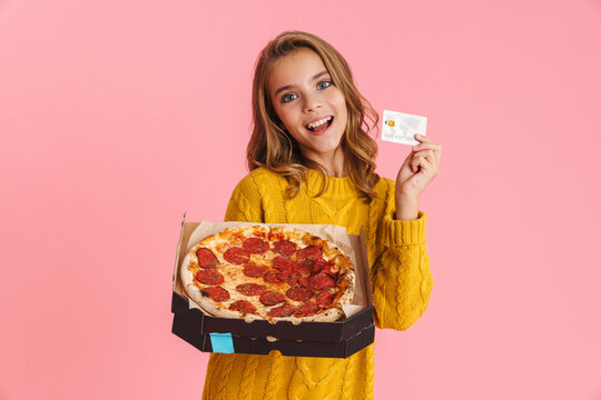 Happy beautiful blonde girl smiling while showing pizza and credit card