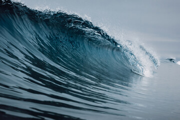 Crashing glassy wave. Breaking ocean waves, perfect swell for surfing