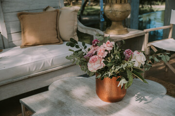 wooden tables and chairs with colorful flowers