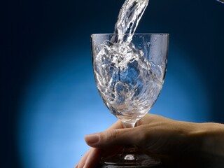 glass with pouring water