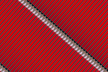 Pattern of pink pencils at brown background
