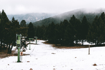 Image of a snowy and abandoned ski resort, during winter. It is the Rasos de Peguera station in Berga