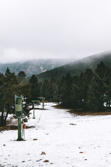 Image of a snowy and abandoned ski resort, during winter. It is the Rasos de Peguera station in Berga