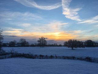 Sunrise in winter landscape with snow
