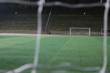 Fototapeta premium Closeup view of goal net in a soccer playground