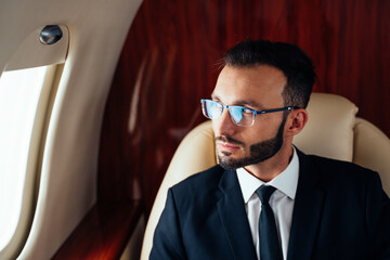 Businessman flying on his private jet.