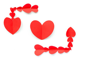 Valentine's Day background. Red paper hearts are lined with a rectangle, not closed, on a white background with a place for text and with a heart. Bright colorful hearts for postcards. - 404883428