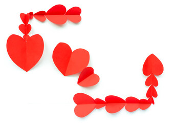Valentine's Day background. Red paper hearts are lined with a rectangle, not closed, on a white background with a place for text and with a heart. Bright colorful hearts for postcards. - 404883436
