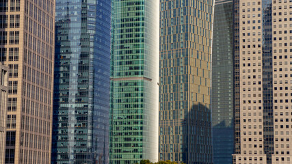 A row of colorful skyscrapers in Shanghai Pudong district - obrazy, fototapety, plakaty