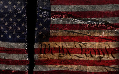 Distressed US flag split in two with We The People constitution text - Powered by Adobe
