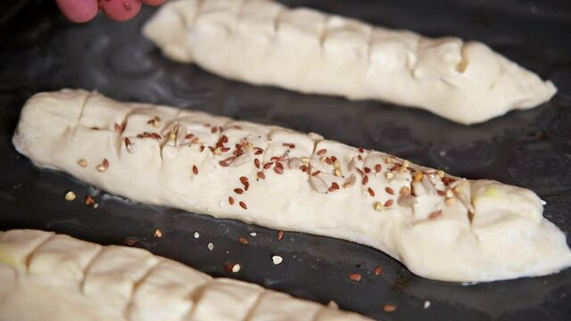 Sprinkle the bread dough with the seed mixture.