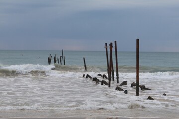 The old wooden bridge and sea wave on the beach  background at Khao Pilai, Phangnga, Thailand