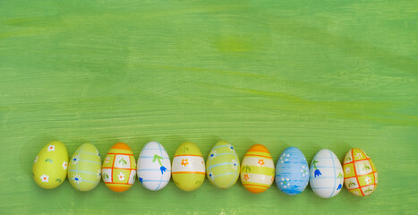 multicolored easter eggs in  a row, design mock up template or background, large free copy space