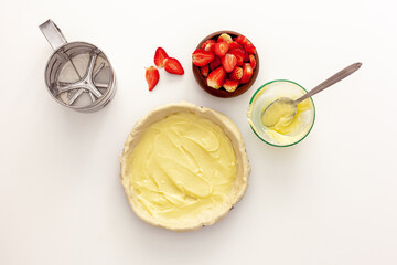 Making strawberry pie for valentine's day. The cake is decorated with small hearts