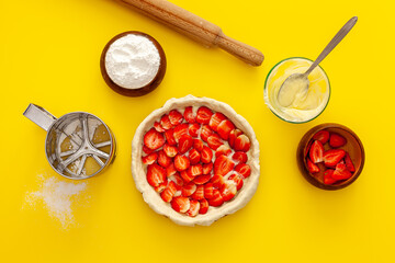 Making strawberry pie for valentine's day. The cake is decorated with small hearts