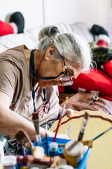 elderly lady working on crafts