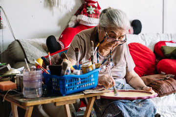 elderly lady working on crafts