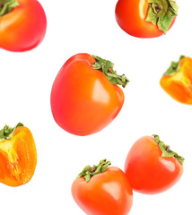 Fototapeta premium Falling delicious ripe persimmons on white background