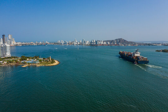 Cargo ship enters the port in Cartagena Colombia aerial view.