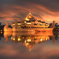 Burmese royal barge Golden Karaweik palace on Kandawgyi Lake in Bogyoke Park in Yangon while sunset, Myanmar (Burma)