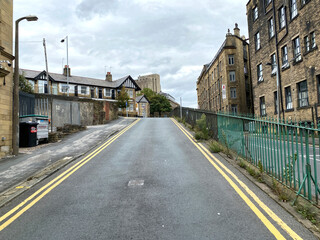 Looking up the, slip road, next to Grattan Road, with mills, and houses in the centre of, Bradford, Yorkshire, UK