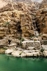 Green water lagoon and the rocks in Wadi Shab, Oman.