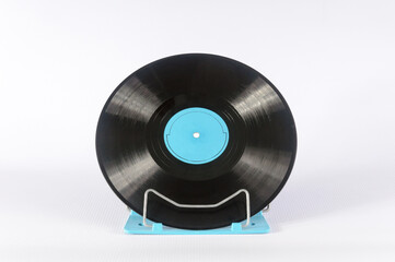 Vinyl record with music on a stand