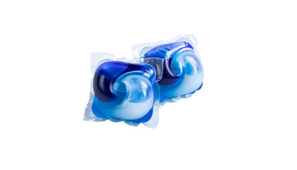 Two blue capsules of gel for washing clothes on a white isolated background close-up. copy space