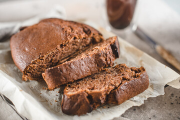 Banana bread sliced with coffee. Vegan pasrty. Home bakery concept. Close-up