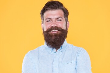 Obraz premium brutal bearded hipster with groomed beard is professional haircutter in white shirt, hairdresser