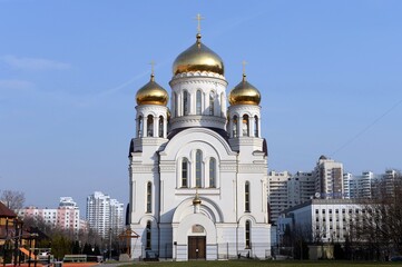 Fototapeta na wymiar Church of All Saints in the land of Russia shone in the Moscow district of New Cheryomushki