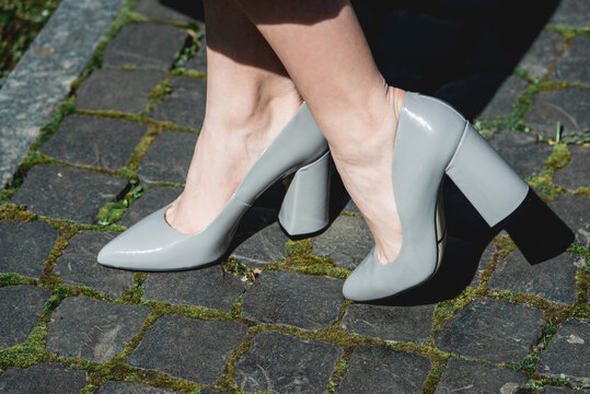 high heeled grey shoe. street photo. Fashion style footwear