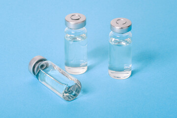 Covid-19 vaccine close-up. Glass vials with liquid. Treatment of infections and diseases