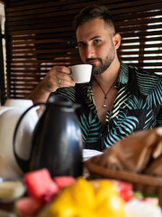 man drinking coffee