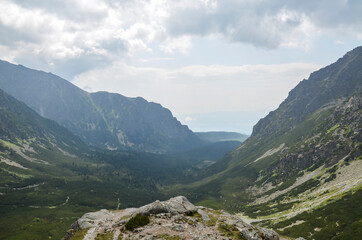 High rocky peaks national park of the High Tatra mountains with mountain Valley and sky with clouds. Slovakia  
