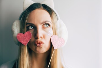 Close up portrait of a young fashion beautiful blonde woman. Girl hipster with pink hearts. Valentines day. Love.Space for text. - 404920237