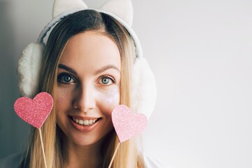 Close up portrait of a young fashion beautiful blonde woman. Girl hipster with pink hearts. Valentines day. Love.Space for text.t - 404920279