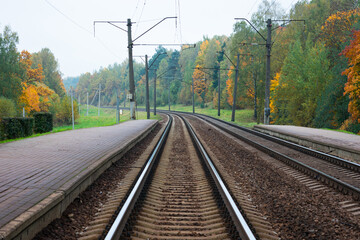 Fototapeta na wymiar Railway tracks outside the city, railway rails, close up