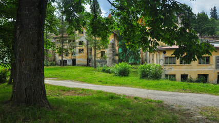 Fototapeta na wymiar Uninhabited, abandoned old buildings at Borsec Resort, Romania.