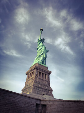 The Statue of Liberty pointing toward sky