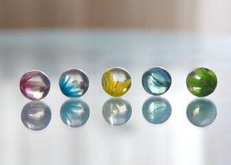marbles on a mirror surface