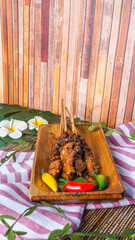 Grilled chicken skewers served with peanut dipping sauce. Chicken satay with peanut sauce.