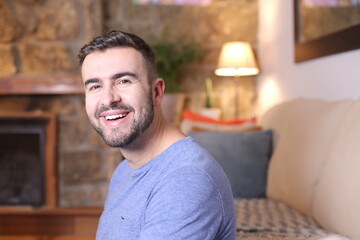 Fototapeta premium Handsome man smiling at home
