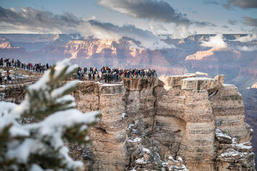 Large groups of people enjoying the view of the Grand Canyon 