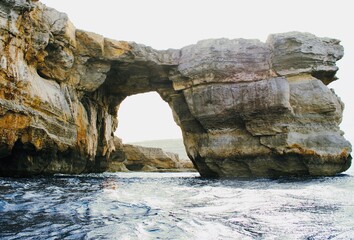 Fototapeta na wymiar The Azure Window, also known as the Dwejra Window, was a 28-metre-tall natural arch on the island of Gozo in Malta. The limestone feature, which was in Dwejra Bay. It collapsed on 8 March 2017.