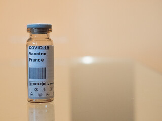 Covid-19 vaccine over glass with France label