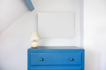Empty blank picture frame in a rustic room