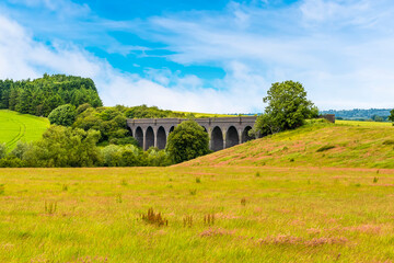 A view across the fields towards the old abandoned viaduct near Catesby, Warwickshire, UK